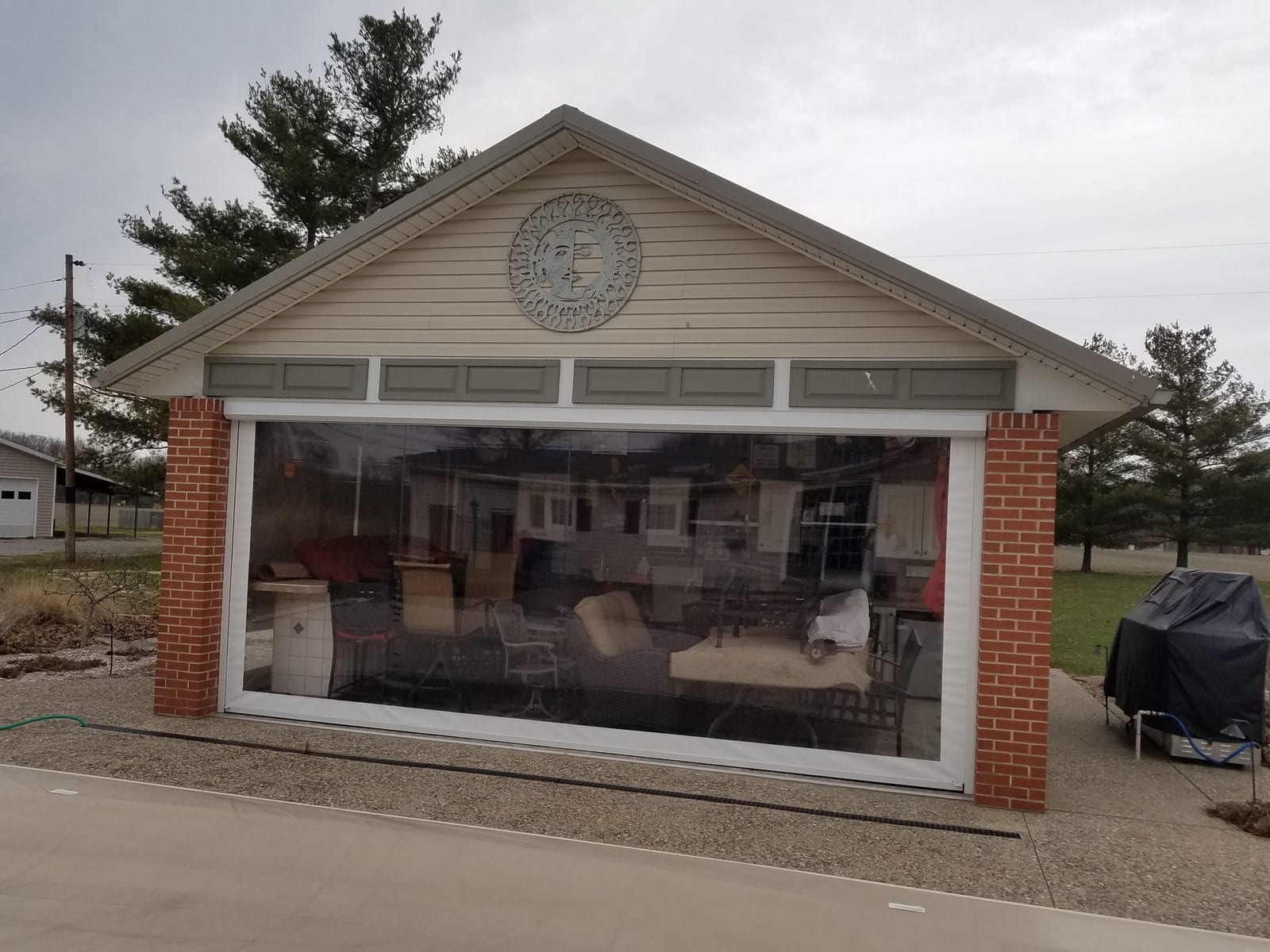 Motorized screen on brick outdoor pavilion