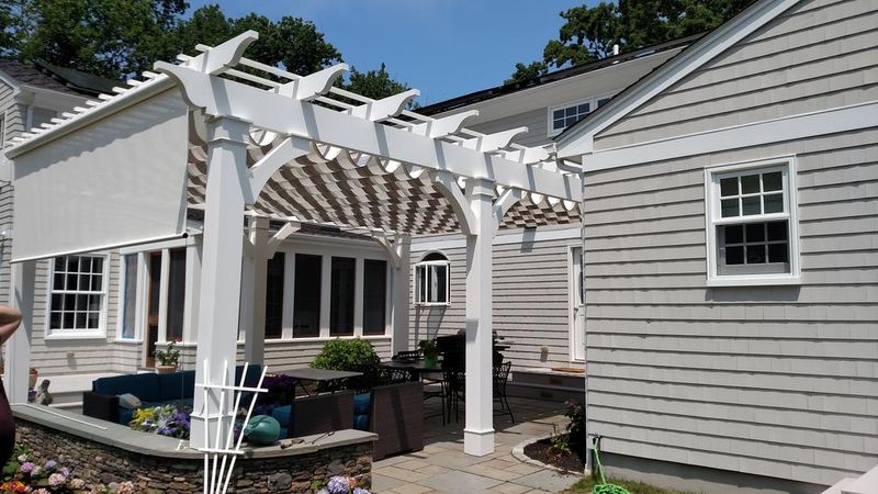 RetractableAndPergola1 striped awnings outside of commercial building