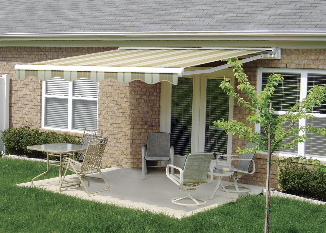 RetractableAwnings6 striped awnings outside of commercial building