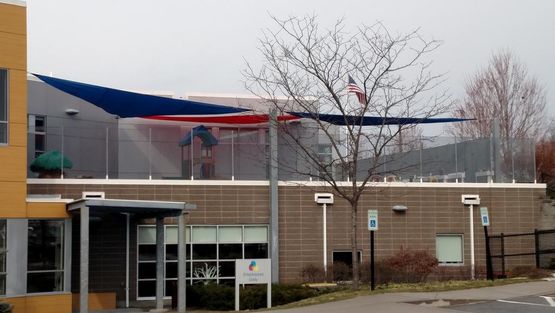 Sailshade2 striped awnings outside of commercial building