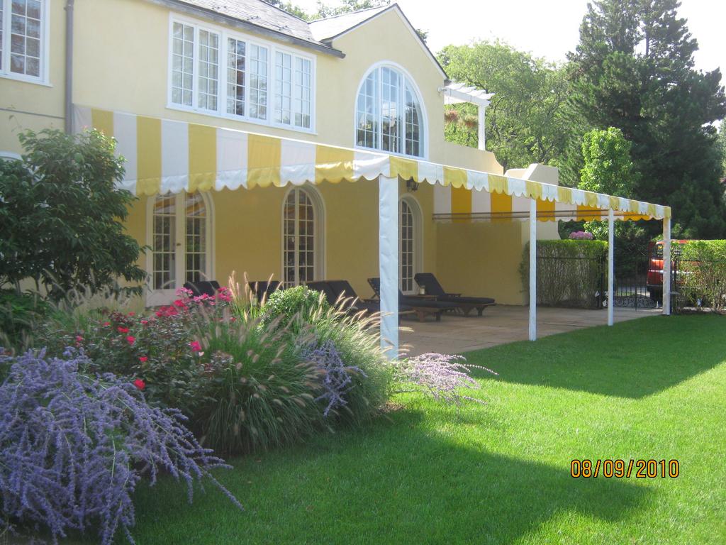 SeasonalDeckShade9 striped awnings outside of commercial building