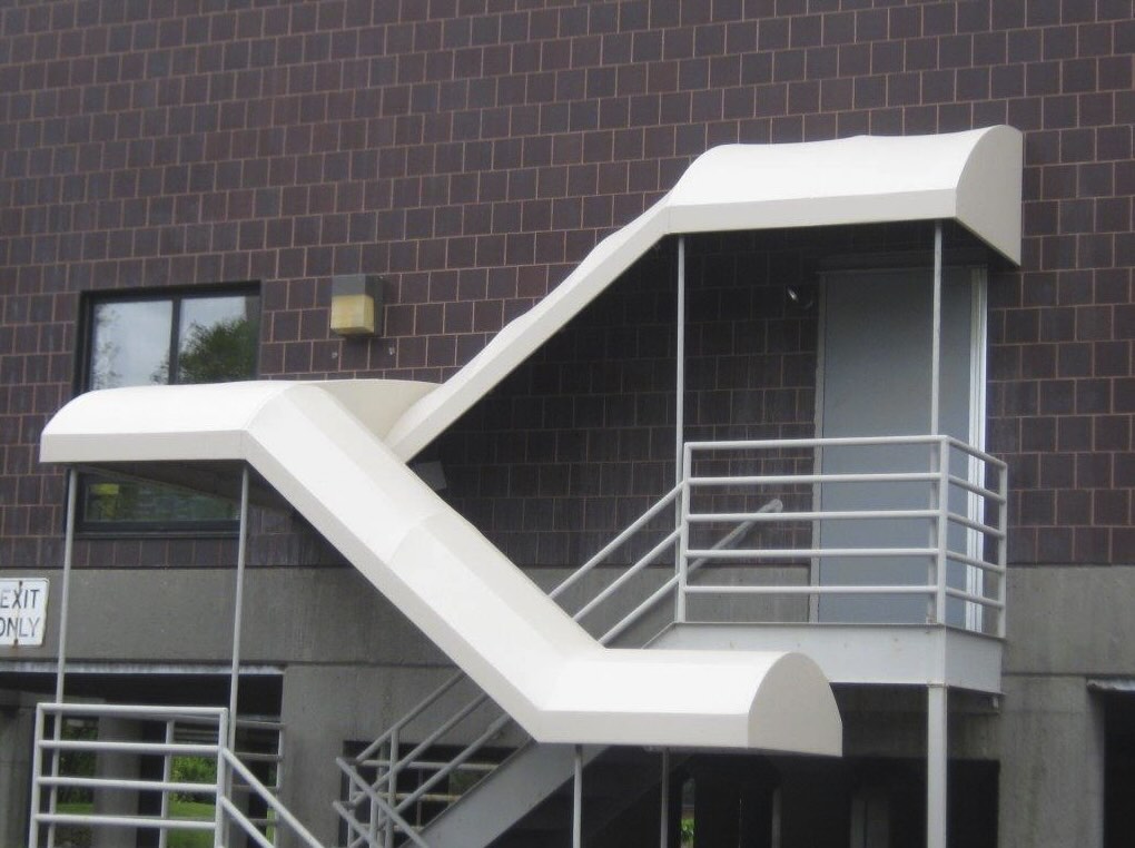 Screenshot striped awnings outside of commercial building